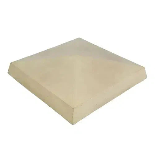 Sand 4 way weathered concrete pier cap with central peak and slopes on all sides for water runoff