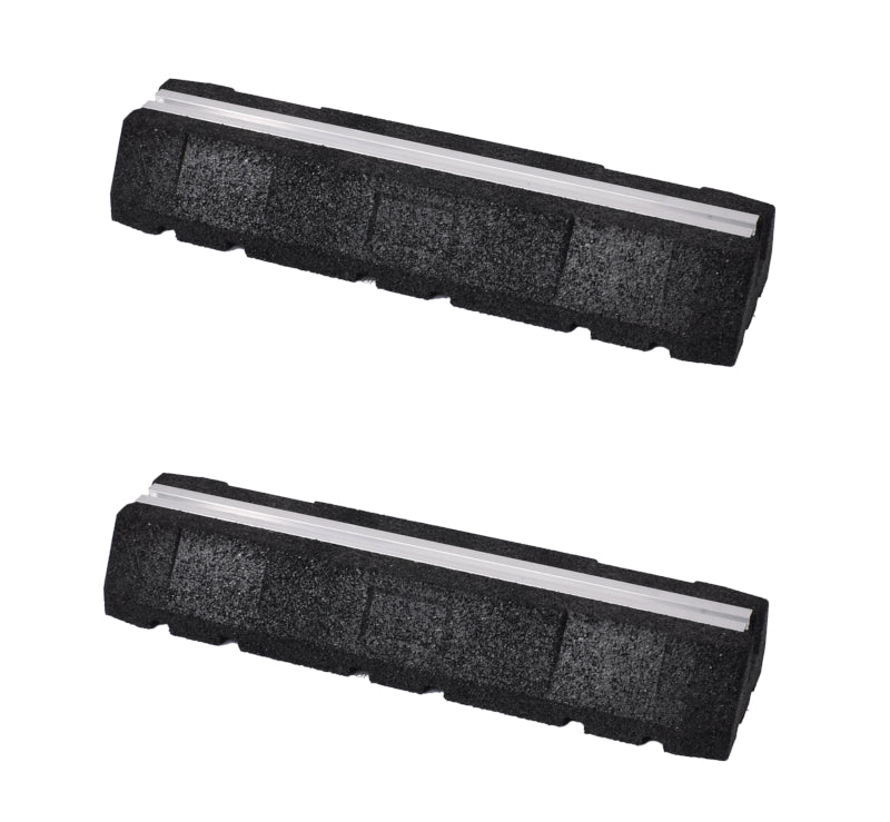 A pair of black, rectangular rubber mounting blocks with an integrated silver aluminum rail running lengthwise, designed for supporting outdoor units.