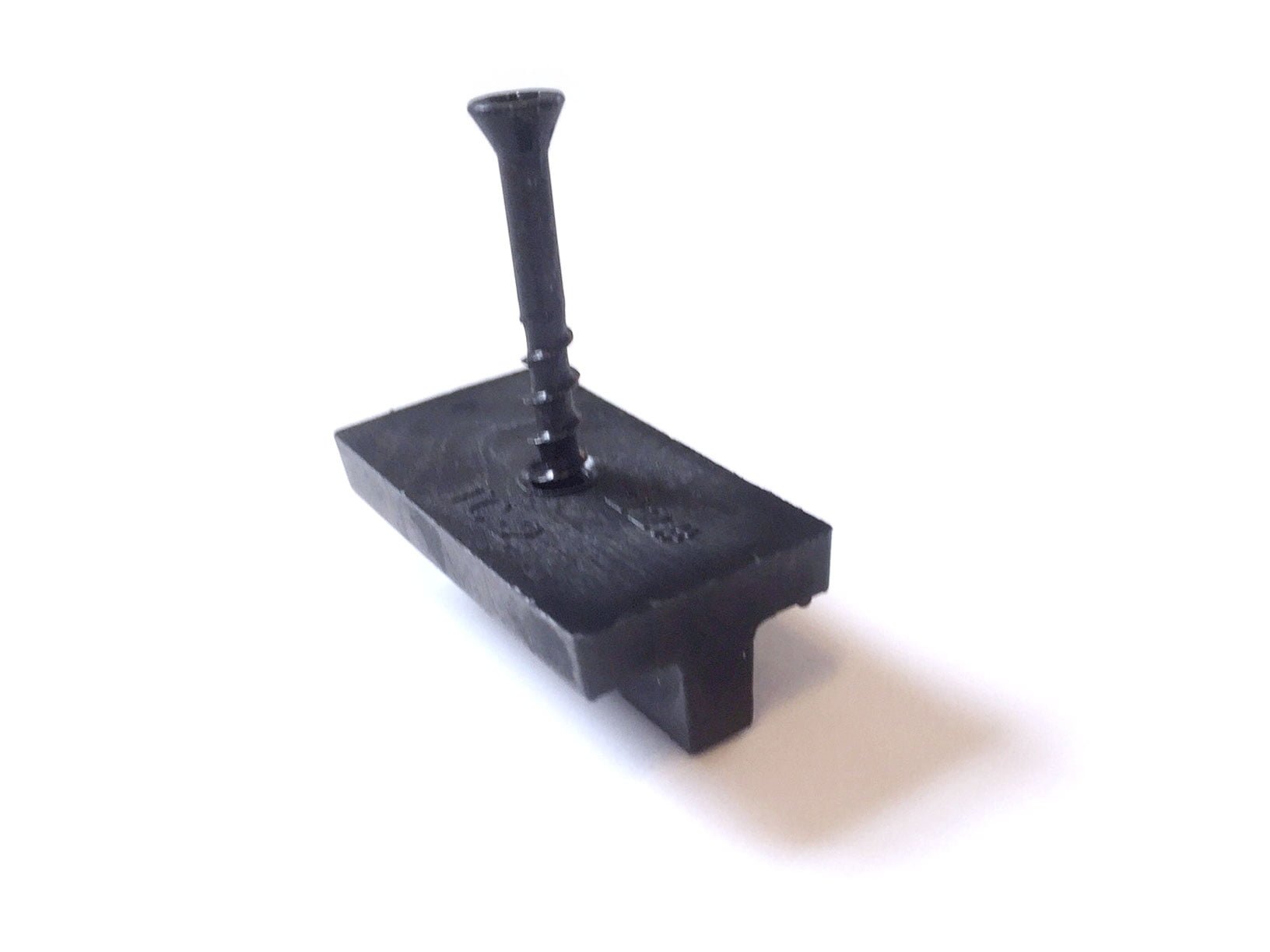 A black TC2 Control Expansion and Contraction fastener for decking, with a screw inserted, on a white background.