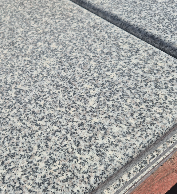 Dolomite Grey granite coping end piece showing natural grey speckled surface