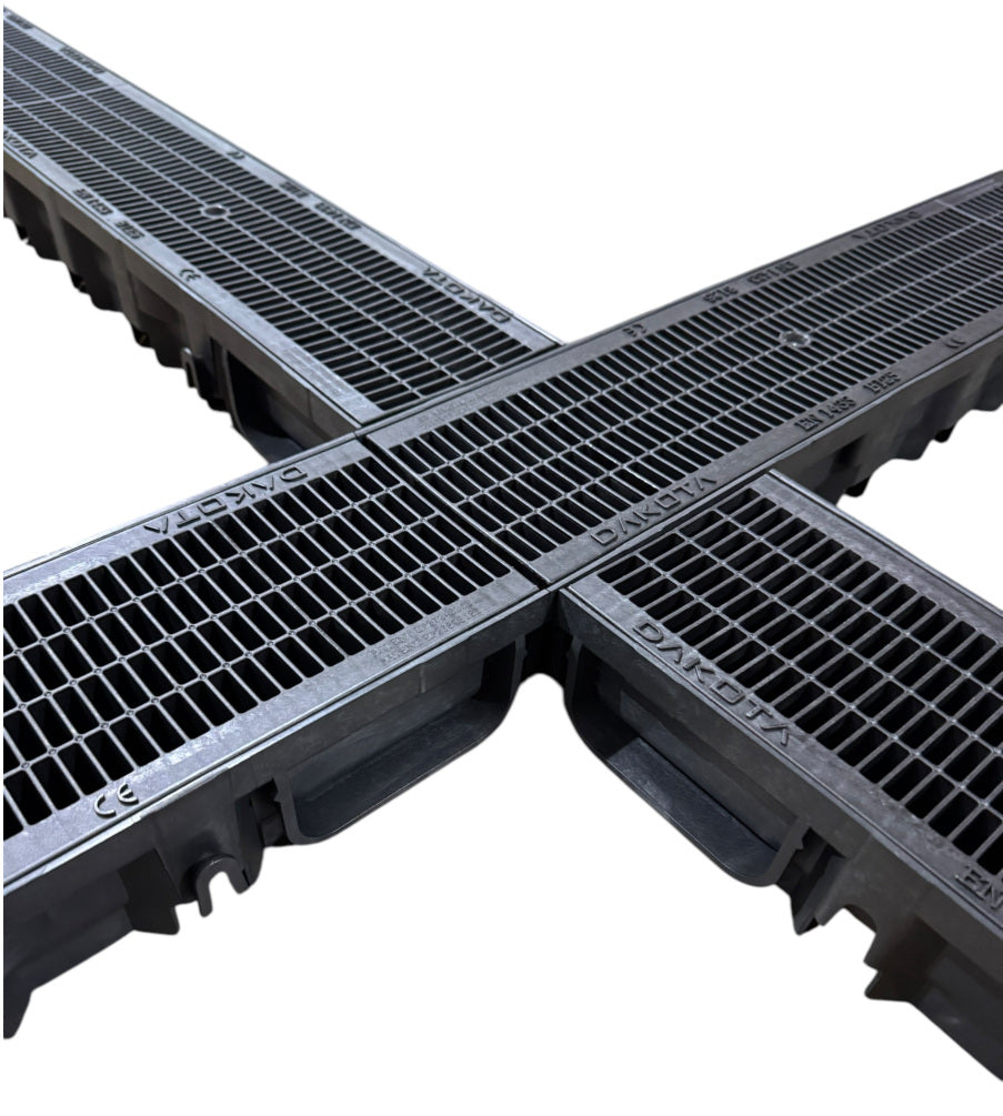 An overhead view of four channel drain sections connected together to form a cross shape.