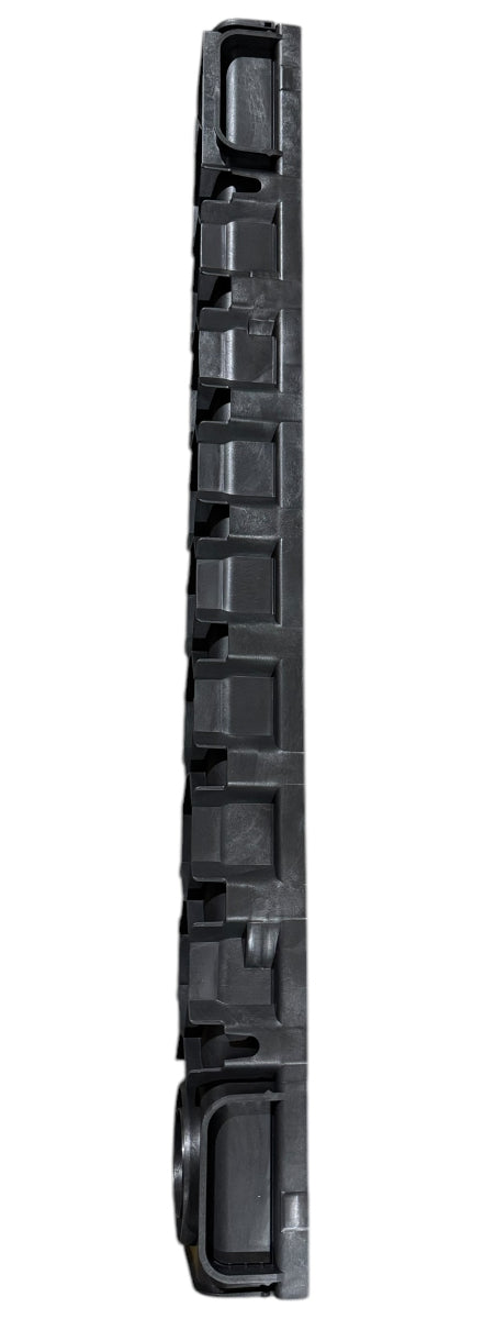 A side view of a section of the channel drain, showing its ridged and reinforced structure.