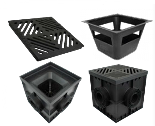 Four black plastic drainage components shown on a plain white background: a slotted drain grate, a square basket-style chamber, a square inlet with a central pipe opening, and a cube-shaped chamber with two circular pipe outlets.