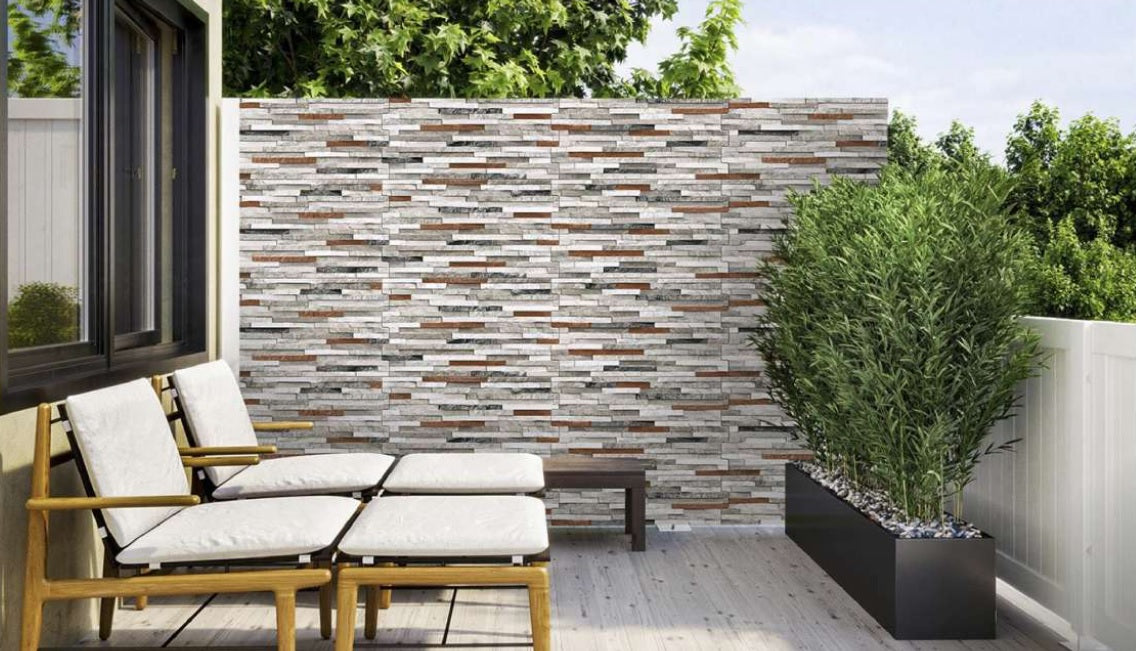 Exterior wall clad with Antarctica Ash Rose porcelain tiles.